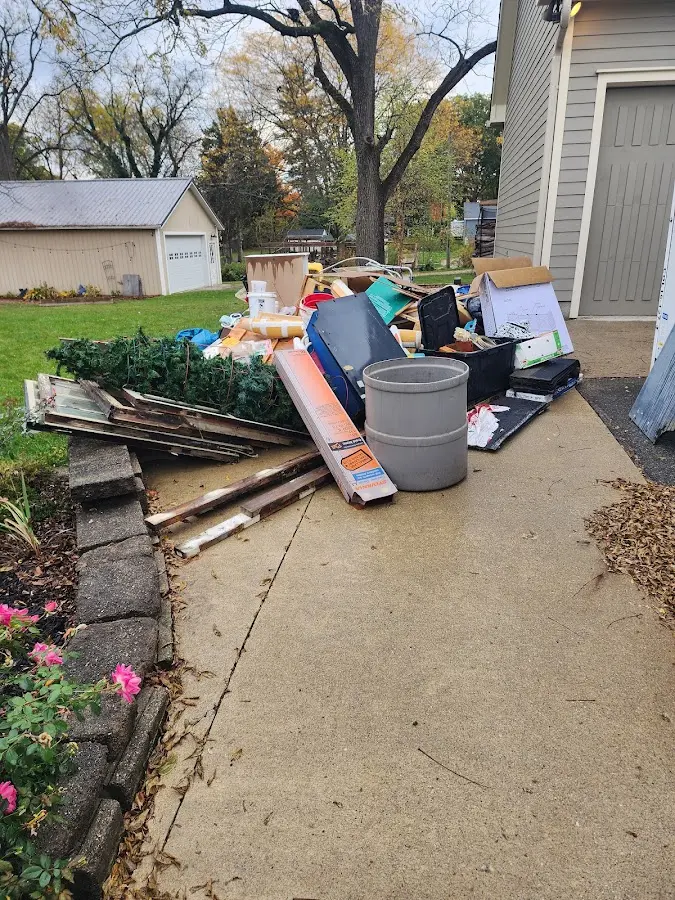 Dumpster being loaded with debris for Residential Dumpster Rental in Eunice